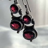 Front view showing two amethyst stones per earring and sterling setting