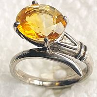 Front angled view of ring showing citrine stone and sterling silver setting