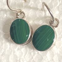 Front view showing oval malachite stones bezel-set in sterling silver
