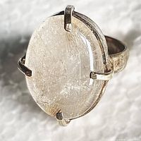 Top view showing oval quartz cabochon and prong setting