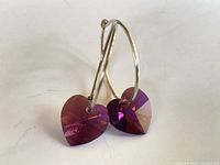 Front view of both earrings standing, showing crystals and hoops