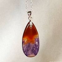 Pendant hanging to show stone colouring and chain detail