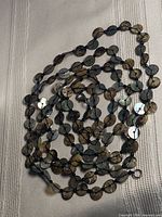Entire necklace coiled to show length and components