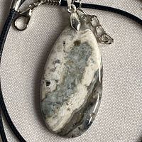 Front view of Ocean Jasper pendant on cord necklace showing stone pattern and hardware