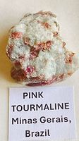 Front view of quartz matrix with pink tourmaline crystals