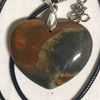 Front view of polychrome jasper heart pendant on cord
