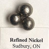 Three refined nickel pellets on label