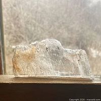 Side-lit view of the selenite slab showing transparency and surface striations