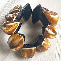 Full view of shell and acrylic stretch bracelet