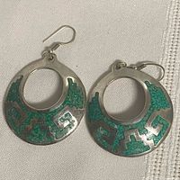 Front view of both earrings showing turquoise inlay design