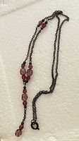 Full view of necklace showing chain, bead arrangement and clasp