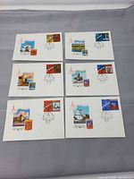 All six envelopes laid out to show stamps, cancellations and illustrations