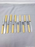 Front view showing 12 knives arranged side by side