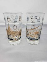 Front view of both Expo 67 glasses showing graphics