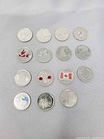 All fifteen commemorative quarters laid out 3×5 grid