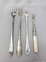 Four forks laid out showing overall style and condition