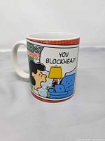 Front view of mug showing Lucy graphic and text