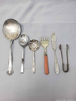 All six serving pieces laid out