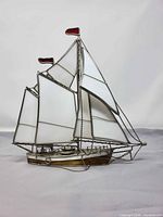 Full view of stained glass sailboat showing sails, hull and overall form
