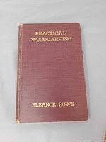 Front cover of maroon hardcover with gilt title