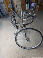 Front three-quarter view focusing on handlebars and front wheel