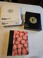 White Medallion Edition box, black slipcase, basketball-graphic binder visible