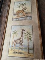 Overall view of framed print showing tiger and giraffe illustrations