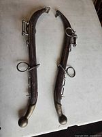 Pair of wooden horse hames with brass and iron fittings