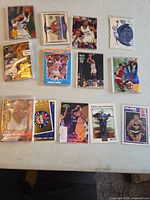 Overview of multiple sleeved basketball cards on table