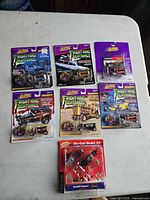 Seven Johnny Lightning Boothill Express items laid out on table