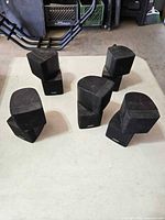 Five Bose swivel cube speakers arranged on table