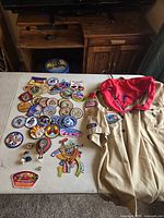 Overall view of shirt, neckerchief and pile of patches