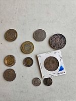 Overall view of all coins spread on white surface