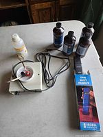 Overview of generator unit, conductivity tester and solution bottles