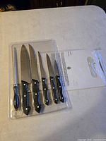 Sealed blister pack containing five knives and honing steel