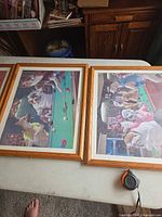Two framed dog-pool prints side by side