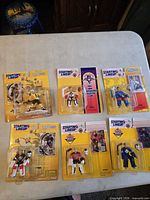 Six sealed Starting Lineup NHL figures on table