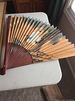 Large folding fan with painted pine and bird