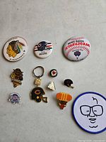 Overview of all pins, keychain and patch laid out