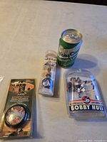 Group shot showing yo-yo, watch, figurine, soda can