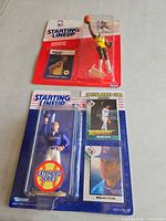Front view of both blister-packed figures showing Jabbar and Ryan sets