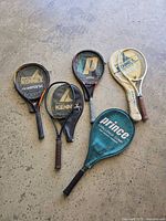 All five rackets laid out on floor