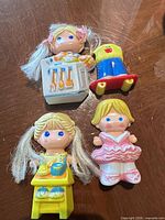 Group shot of four Dolly Pops dolls with accessories