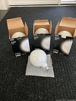 Three boxed DVI G40 bulbs and one loose large globe bulb