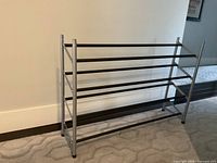 Overall view of the silver frame, black bar 3-tier shoe rack