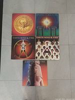 All five Earth, Wind & Fire albums laid out showing front covers