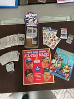 Full lot overview showing card packs, sticker sheets, mask booklet, hologram cards and magazine