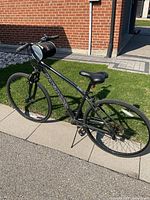 Full left-side view of Nakamura hybrid bicycle on pavement