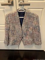 Front view of multi-colour tweed Nine West blazer on hanger