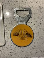 Front view of bottle opener showing Maple Leaf Gardens graphic